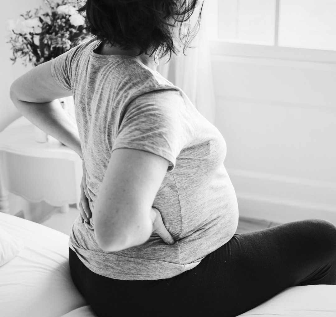 Prenatal Chiropractic Care - Pregnant woman experiencing lower back pain